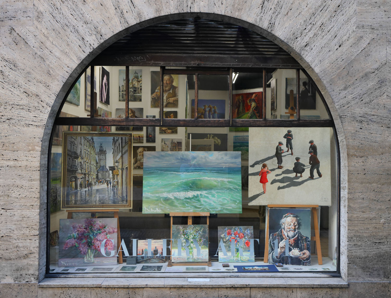 The arched shop window of Gallery Art 11 on Michalská street